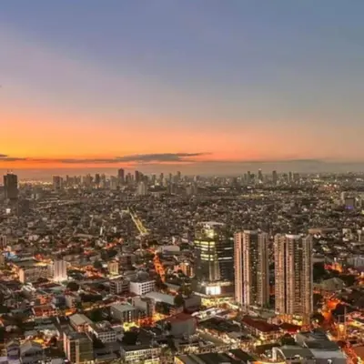 a view of a city with a sunset in the background at Air Residence in Manila