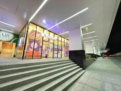 a store front of a shopping mall at night at Air Residences - Panoramic City View near Airport - 2932 in Manila