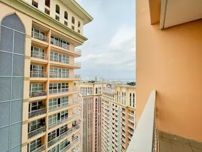 a view from the balcony of a building at Chic BGC Condo by Grand Canal Mall #vlrtb27b in Manila