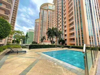 a swimming pool in a city with tall buildings at Chic BGC Condo by Grand Canal Mall #vlrtb27b in Manila