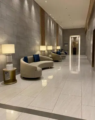 a lobby with couches and lamps in a building at One Bedroom Condo Unit Fame Residences Tower 4 in Manila
