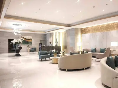 a lobby with couches and chairs and a fireplace at One Bedroom Condo Unit Fame Residences Tower 4 in Manila