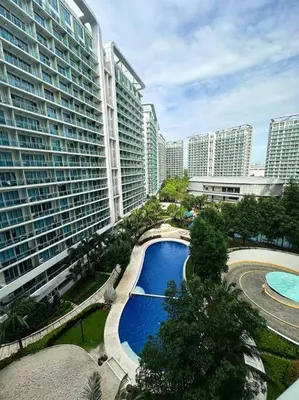 an overhead view of a pool in a city with tall buildings at Casa Alivia at Azure UrbanResort in Manila
