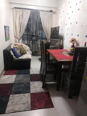 a living room with a couch and a table at Florida sun condo near lyceum in General Trias