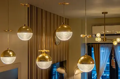 a bunch of lights hanging from a ceiling at MOA Staycation Haven Cozy 1BR Retreat with Balcony at Shore 3 in Manila