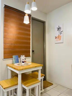 a room with a table and benches and a door at Fablo Getaway Staycation in Santa Rosa