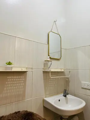 a bathroom with a sink and a mirror at Fablo Getaway Staycation in Santa Rosa