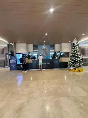 a christmas tree in the middle of an airport terminal at shore staycation 559 in Manila
