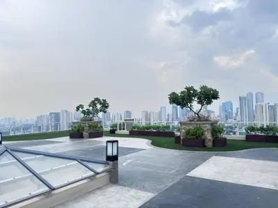 a view of a city from the roof of a building at 1-BR Condo with Pool & Skyline Views in Pasig in Manila