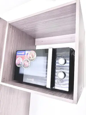 a dvd and a box sitting on a shelf at Hotel in Mandaluyong in Manila