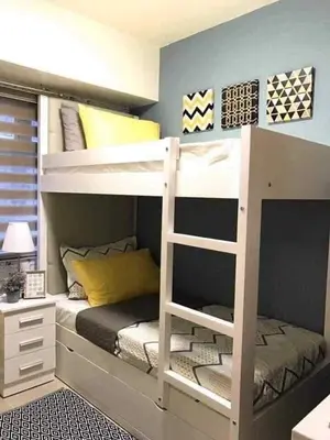 a bedroom with a bunk bed with a ladder at Hotel in Mandaluyong in Manila