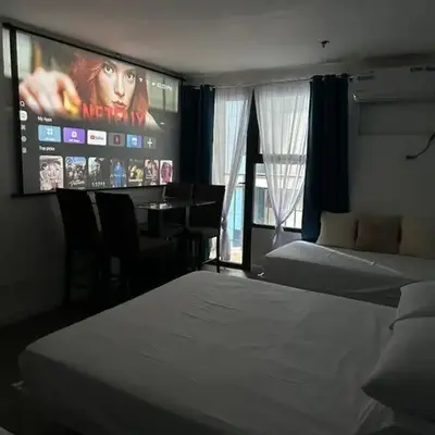 Studio w projector Wifi Netflix and pool access in ADB Tower Ortigas CBD