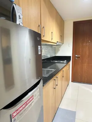 a kitchen with a stainless steel stove top oven at shell staycation in Manila