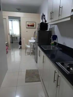 a kitchen with a sink and a counter top at Sea res moa by Elsie D in Manila