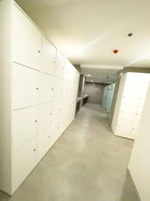 a room with white cabinets and a long hallway at Luxury Hotel near City of Dreams, Solaire, NAIA, and MOA - City of Bridge in Manila