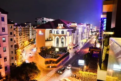 a view of a city street at night with buildings at Newport City Condos in Manila
