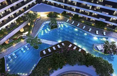 an overhead view of a large building with a swimming pool at Air Residences - High Floor City View near Airport - 5759 in Manila