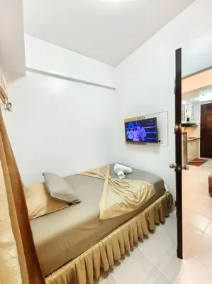 a bedroom with a bed in a room at Condotel Near Airport Terminals in Manila