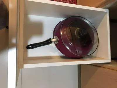 a wine bottle in a shelf with a wine glass at Ivy Condotels Unit -101Newport Boulevard in Manila