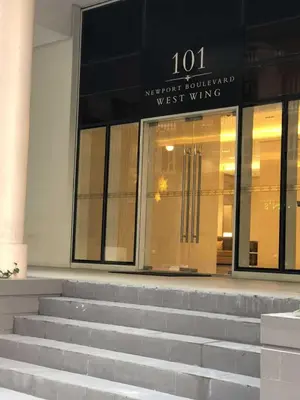 a building with stairs in front of a west wing at Ivy Condotels Unit -101Newport Boulevard in Manila