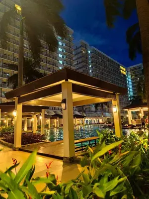 a pavilion in front of a building at night at Mall of Asia Garden view 2 Bedrooms 2 bathrooms in Manila