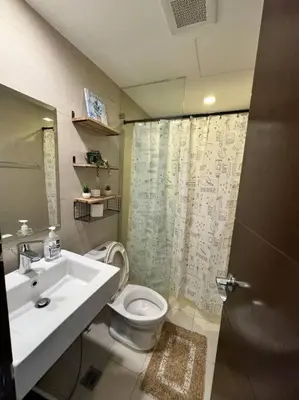 a bathroom with a sink and a toilet at Studio Unit McKinley Hill Taguig cd21H in Manila