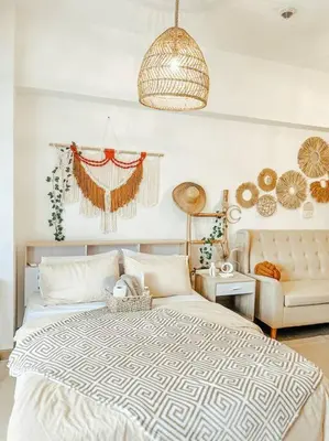 a bedroom with a large bed and a couch at Venice Luxury Residences Studio McKinley Hill in Manila