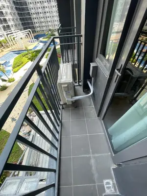 a view from the balcony of a building at Callie's Cozy Home at Shore 3 Mall of Asia in Manila