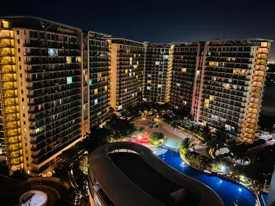 an aerial view of some tall buildings at night at Spacious 1Bedroom Condotel Resort in Manila