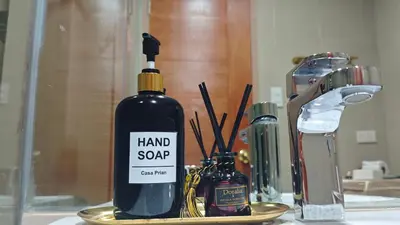 a bottle of hand soap sitting on a table at Casa Prian in Manila