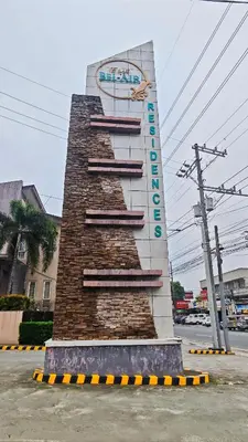 a monument with a sign on the side of a building at Casa Prian in Manila
