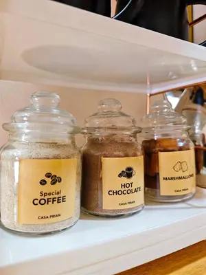 a shelf with four jars of hot chocolates at Casa Prian in Manila