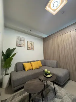 a living room with a couch and a table at M&M Condostay at Shore 2 Residences Tower 2 in Manila