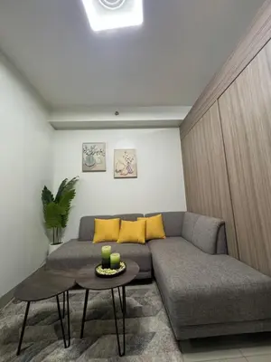 a living room with a couch and a table at M&M Condostay at Shore 2 Residences Tower 2 in Manila