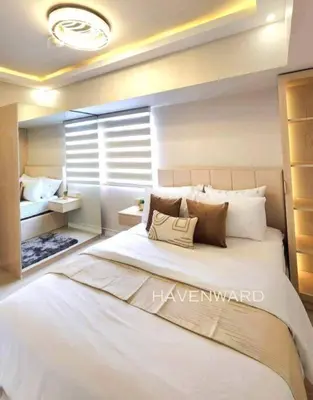 a bedroom with a large white bed with pillows at Luxe 3BR unit in the heart of BGC Taguig in Manila