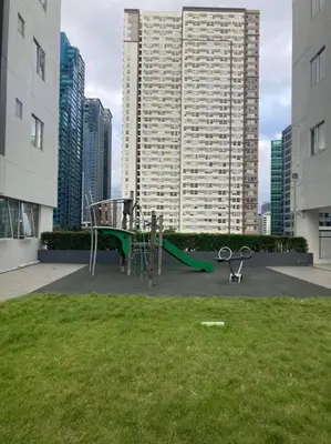 a playground in a city with tall buildings at Luxe 3BR unit in the heart of BGC Taguig in Manila