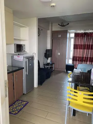 a kitchen and a living room with a kitchen and a room with a kitchen at Ivy Condotels unit-150 Newport Boulevard near terminal 3 and all Airport in Manila