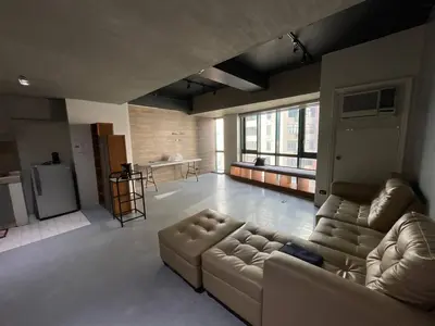 a large living room with a couch and a table at 63 sqm Unit for GET TOGETHER at Poblacion, Makati with Private Parking in Manila