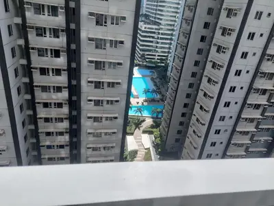 a view from the top of a building with tall buildings at FAME Bedroom in Manila