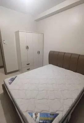 a bed in a room with a white mattress at S Residences Two Beds Room Near MOA Pasay Manila in Manila