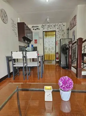a room with a pharmacy with a flower in a vase at Alohas House in Cupang