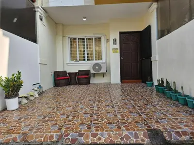 a room with a stone floor and a door at Alohas House in Cupang
