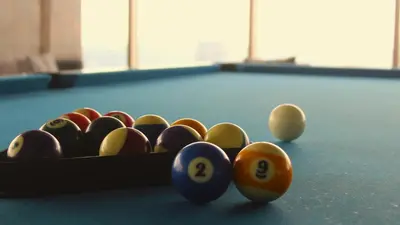 a group of billiard balls on a pool table at SMDC Coast Residences in Manila