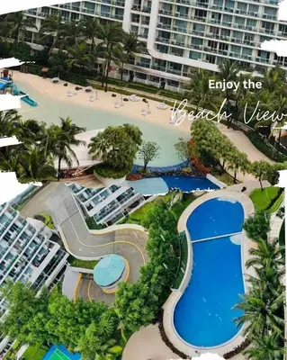 an aerial view of a resort with a beach at Mhax's Place - Azure Parañaque in Manila