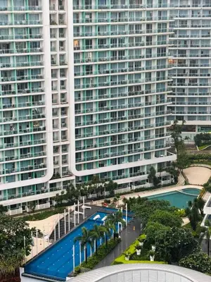 an aerial view of a large building with a swimming pool at Mhax's Place - Azure Parañaque in Manila