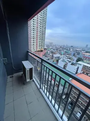 a balcony with a view of a city at Red Residences Chino Roces Makati in Manila