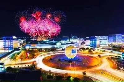 a night view of a city with fireworks at 2BR SEA RESIDENCES By ELSIE D in Manila