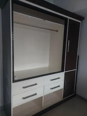 a dresser with a large tv on top of it at 2BR SEA RESIDENCES By ELSIE D in Manila