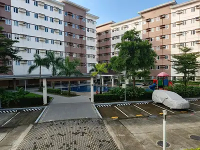 an empty parking lot in front of a building at Happy Stays D - 300mbps - 65