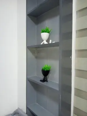 a shelf with two green plants in it at Casa Cintores Condo near PICC with FREE parking in Manila